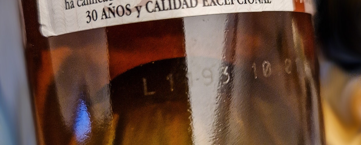 L-codes on glass wine bottle